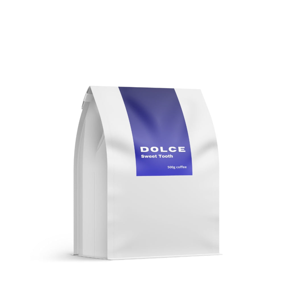 White coffee bag with a blue stripe featuring 'Dolce Sweet Tooth' on a white background