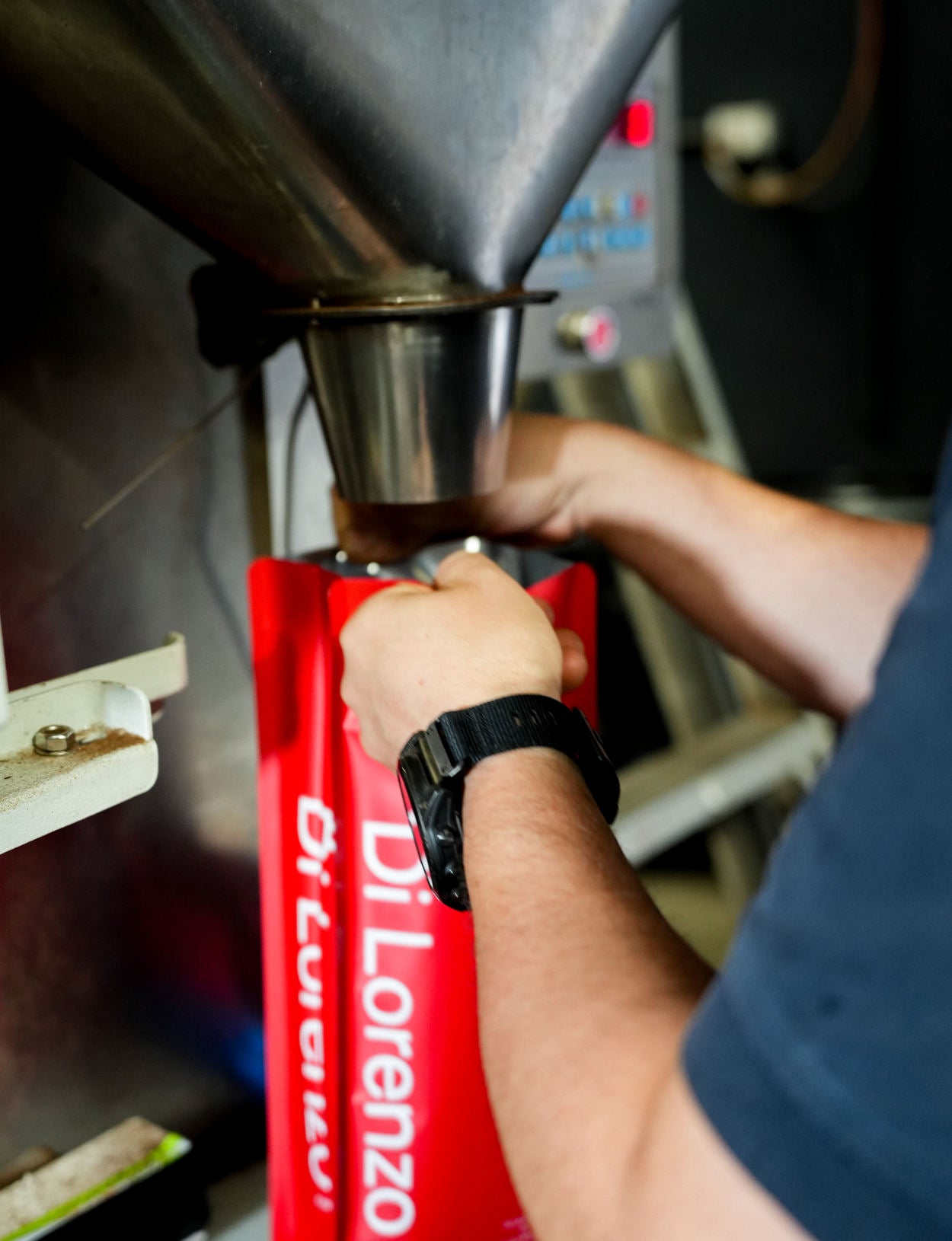 Filling a red Di Lorenzo bag on the line