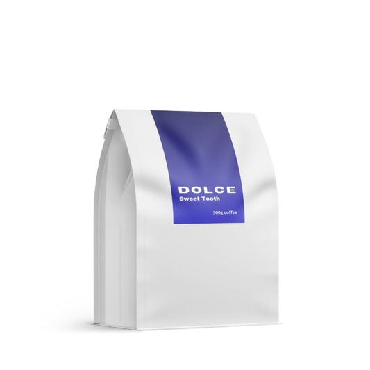 White coffee bag with a blue stripe featuring 'Dolce Sweet Tooth' on a white background